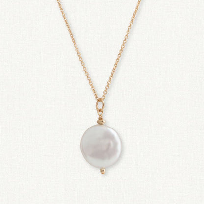 close up of coin pearl pendant necklace