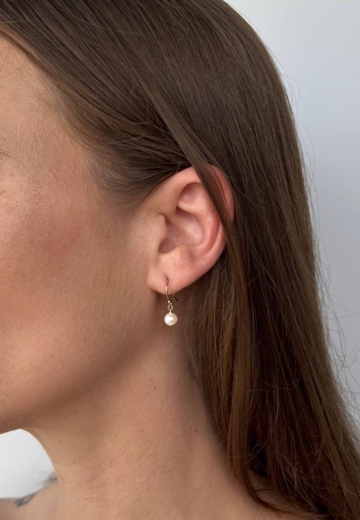 close up of Lucia pearl drop earrings