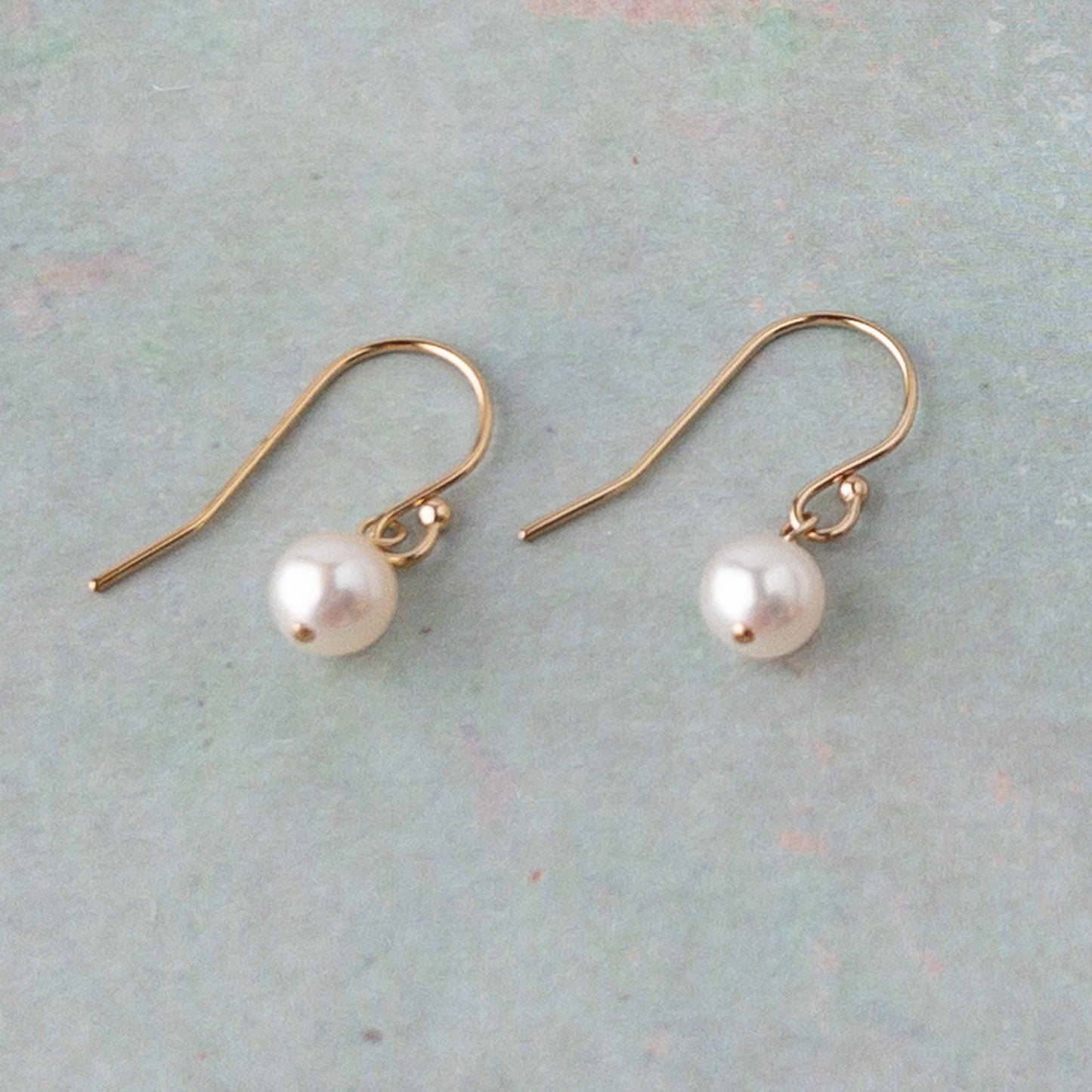 pair of Lucia Pearl Drop Earrings in 14k gold filled