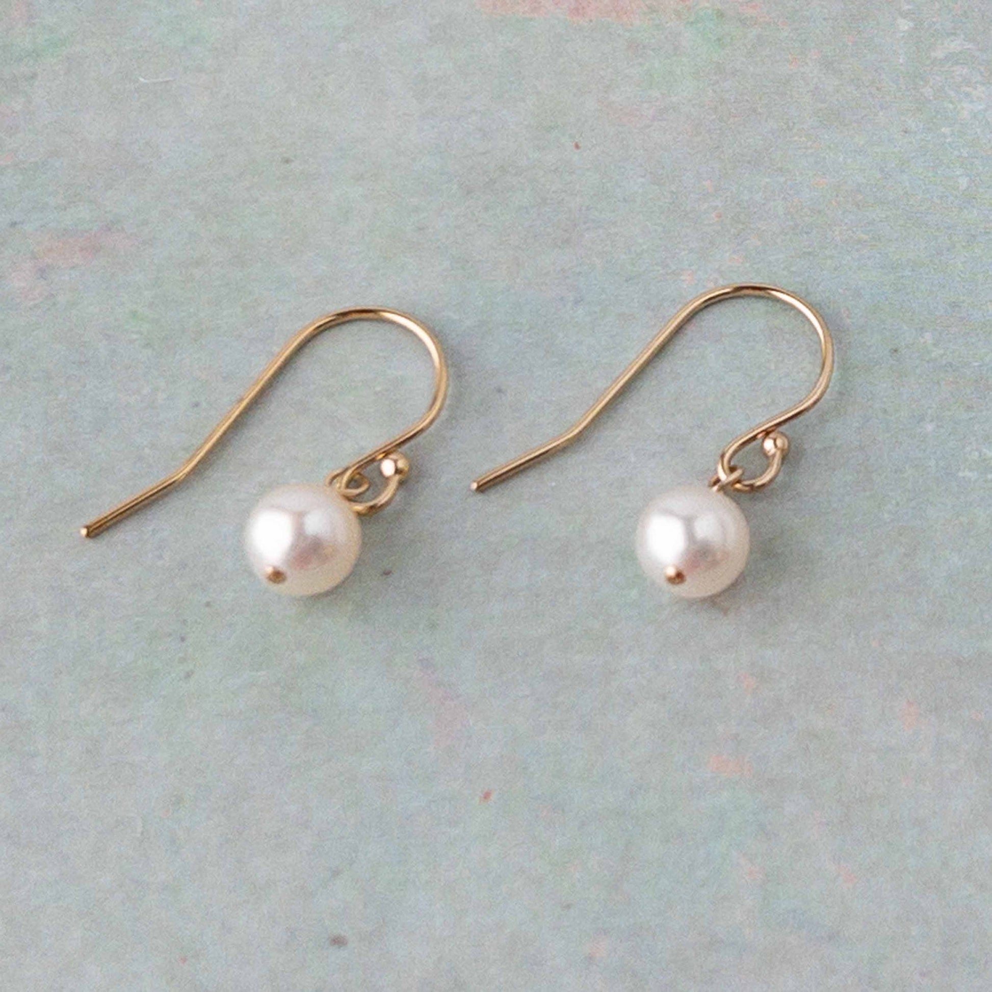 pair of Lucia Pearl Drop Earrings in 14k gold filled