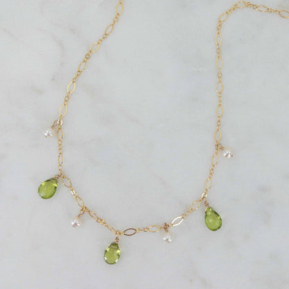 close up of peridot necklace in 14k gold filled.  Also, available in sterling silver