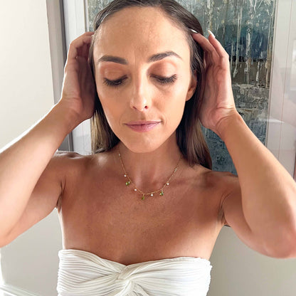 model wearing peridot necklace with pearls and peridot gemstones