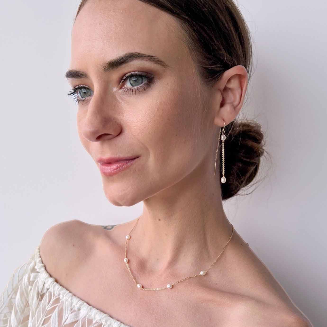model wearing Rosa Pearl Threader Earrings