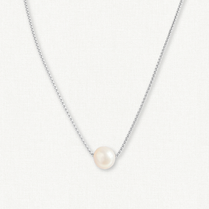 sterling silver pearl necklace on white background