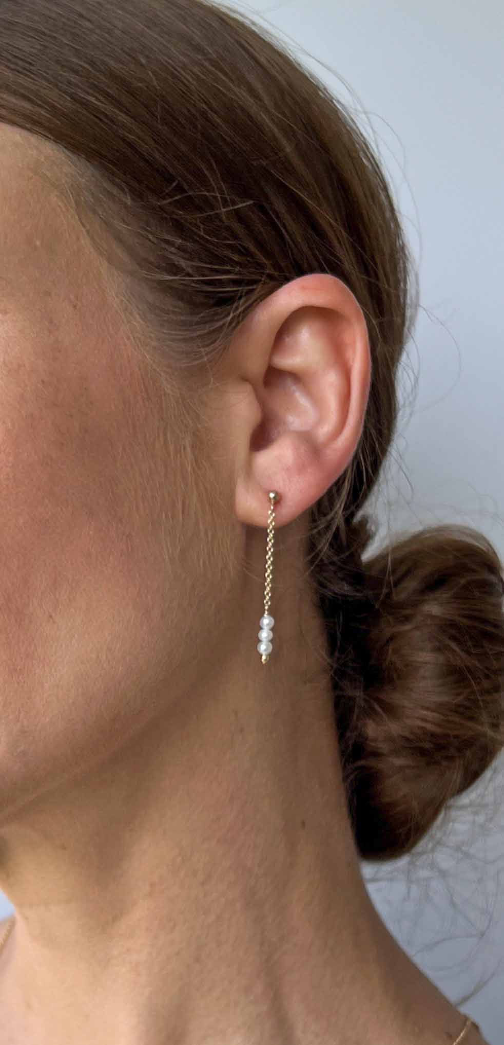 Long Dangle Earrings with dainty freshwater pearls.  Close up on model.