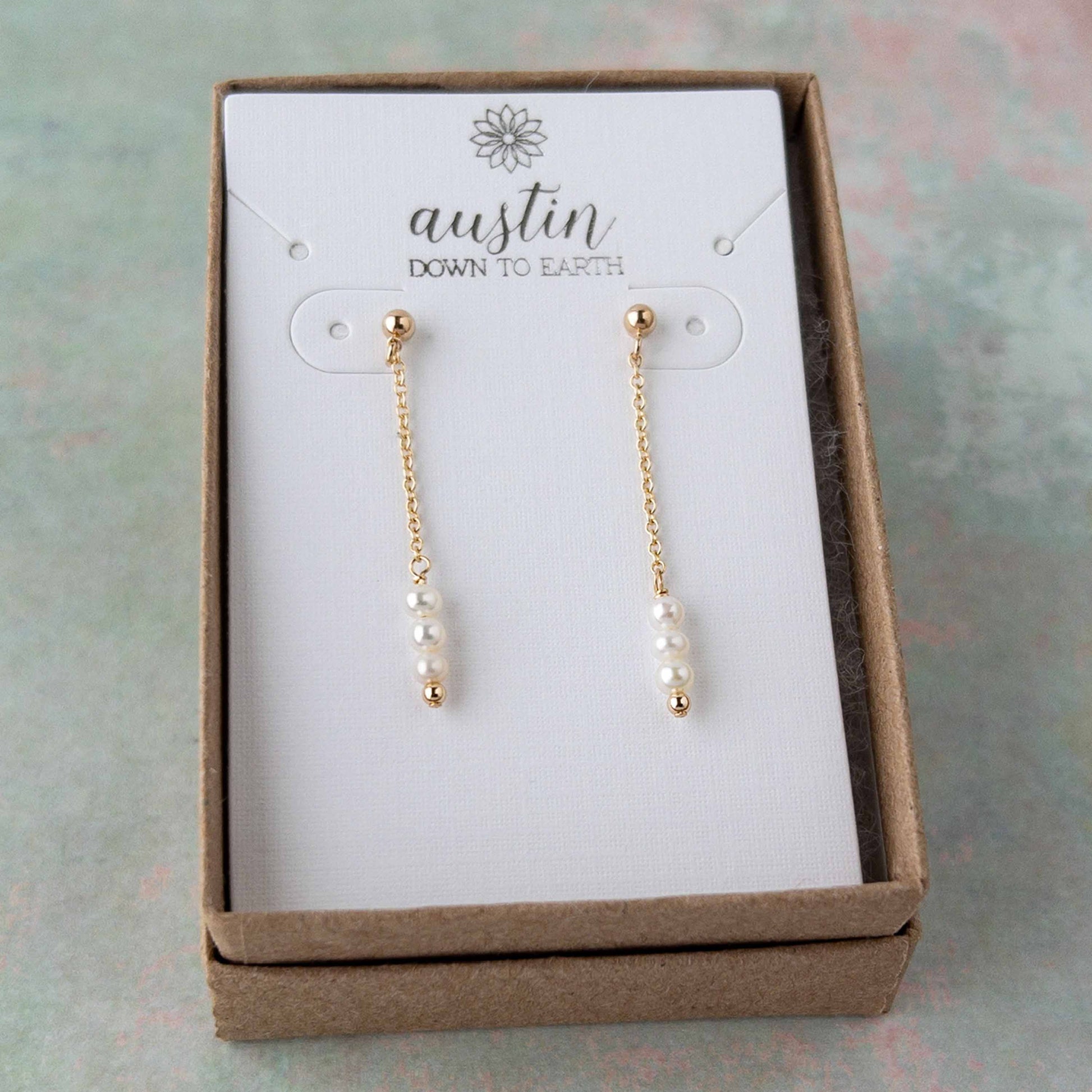 Set of tiny pearl drop earrings in gift box from Austin Down to Earth.