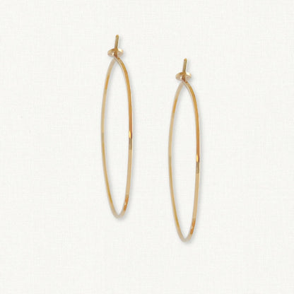 Gold Minimalist Hoop Earrings on white background.  