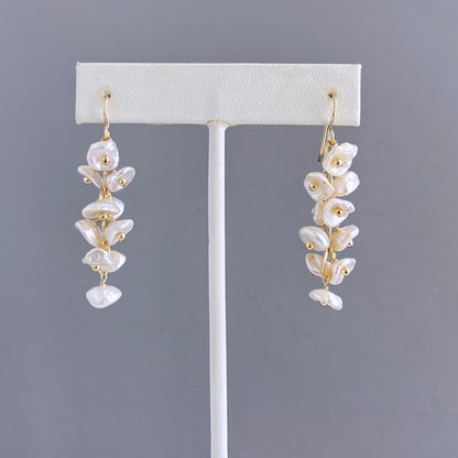 keshi pearls on gold ear wires dangle earrings on earring stand