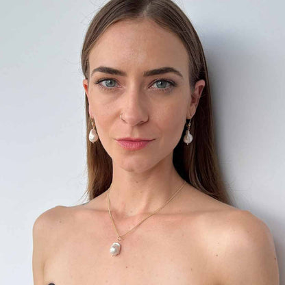 Model wearing Large Pearl Necklace with matching baroque pearl earrings