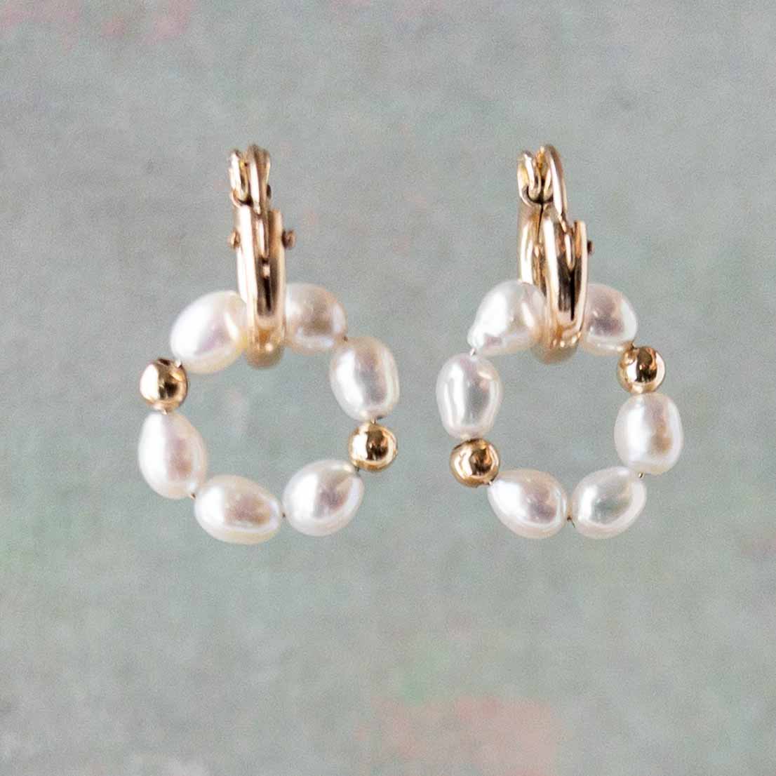 Vivara Tiny Baroque pearls hung from small hoop earrings