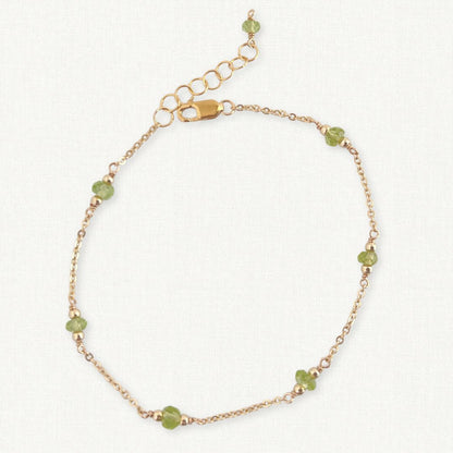 Peridot Gemstone Bracelet in 14k gold filled on beige background