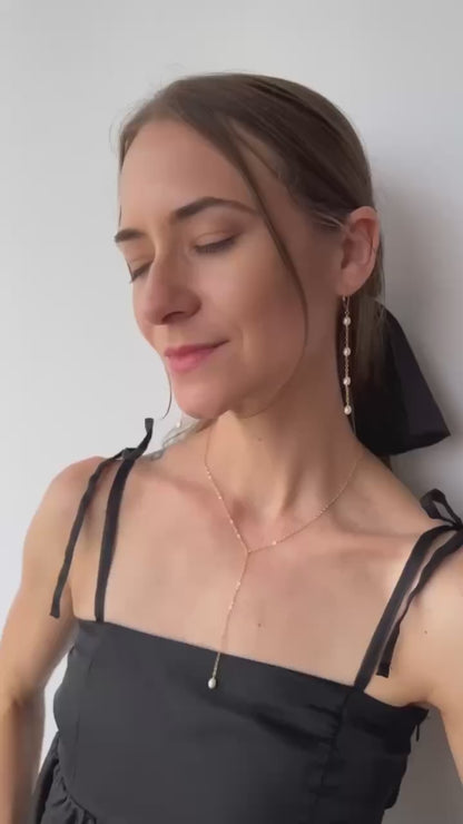 video of model in necklace and earrings from Rosa Collection