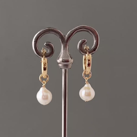video of 360 view of pearl huggie earrings