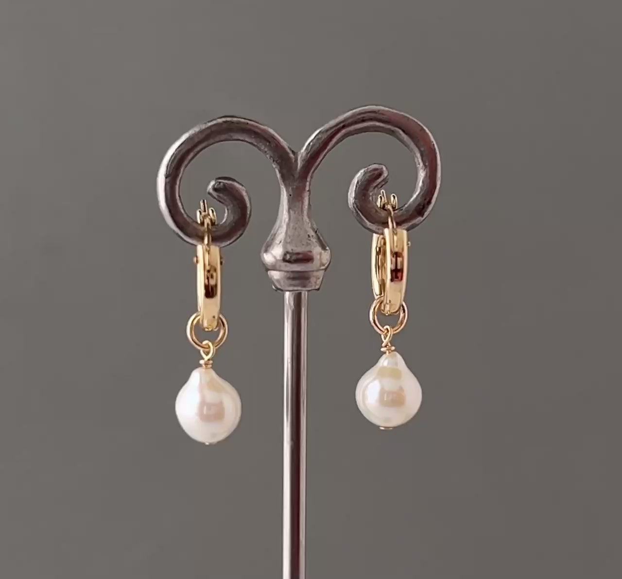 video of 360 view of pearl huggie earrings