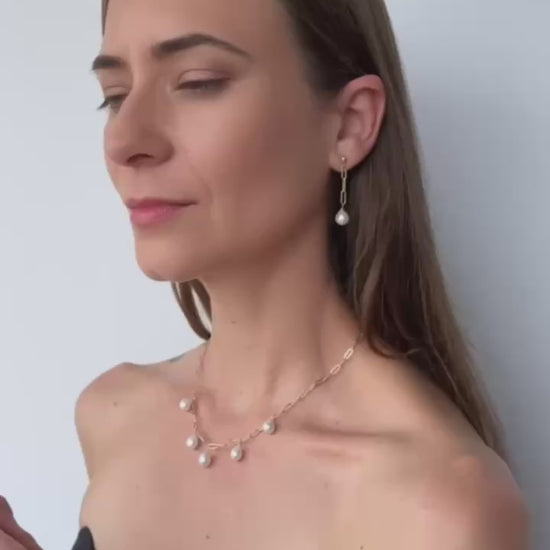 video of model showing the necklace, earrings and bracelet set of baroque pearls