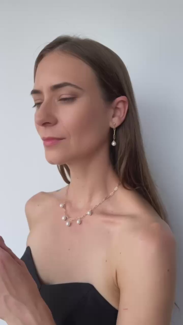 video of model showing the necklace, earrings and bracelet set of baroque pearls