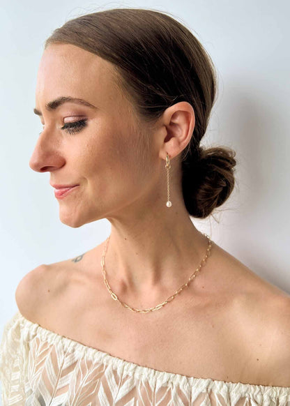 model wearing Rosa Huggie Earrings