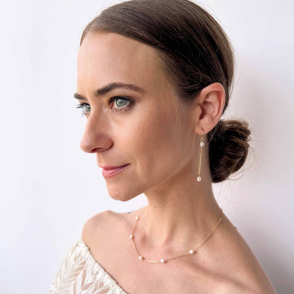 model wearing necklace and earrings from Rosa Collection
