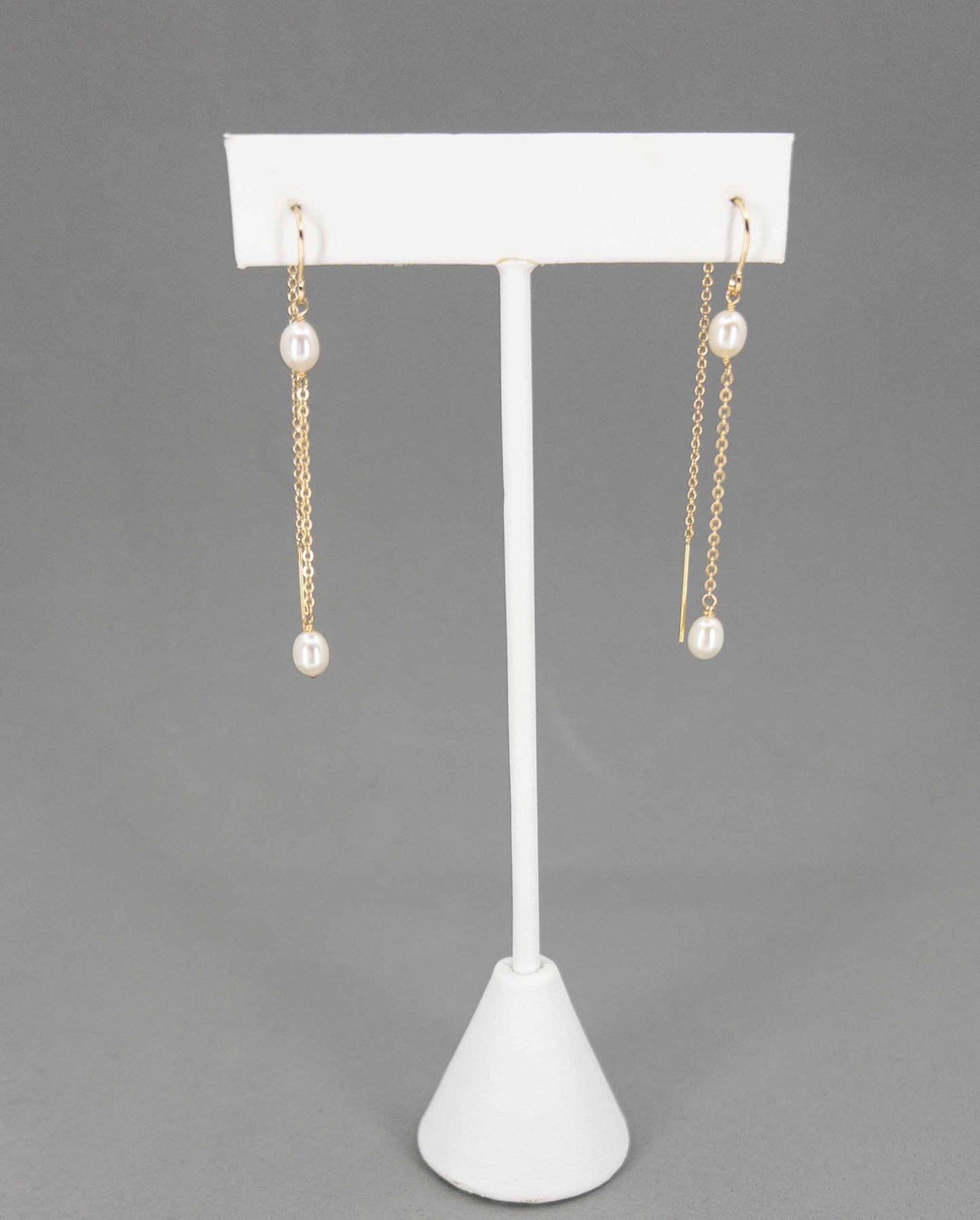 Rosa Pearl Dangle Earrings on Earring Stand