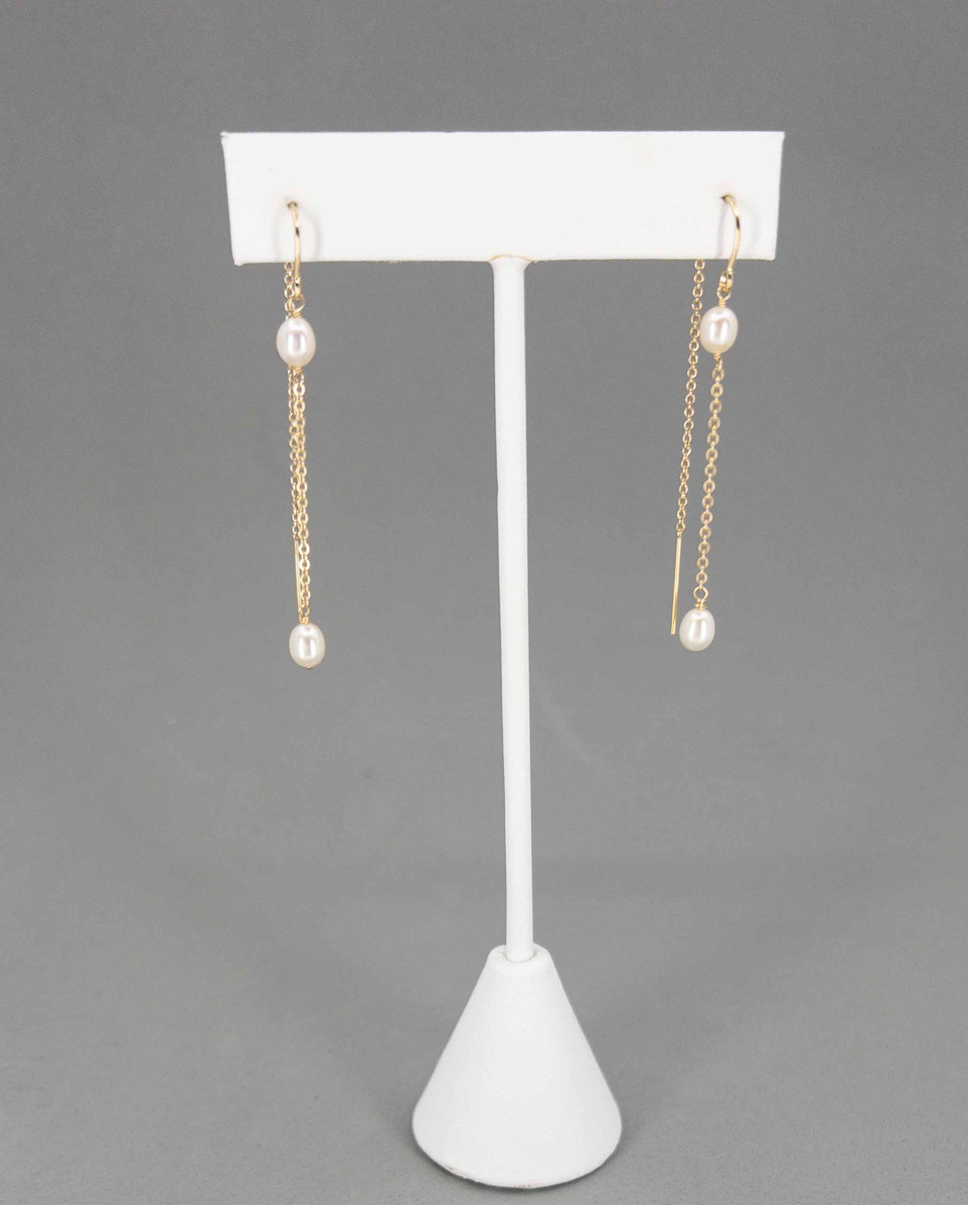 Rosa Pearl Dangle Earrings on Earring Stand