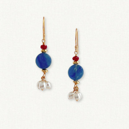 Small round kyanite stone with 3 dangling pearls below and a small ruby on top on fishhook ear wire
