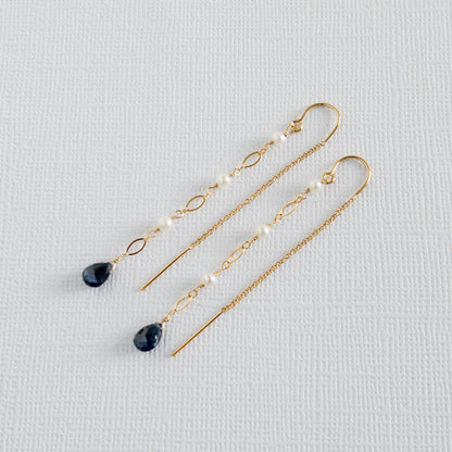 close up of sapphire earrings in 14k gold filled with freshwater pearls