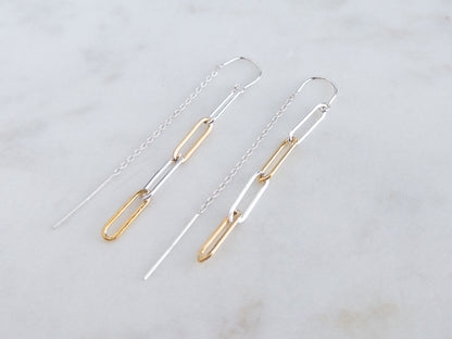 pair of mixed metal threader earrings on marble surface.  Threader is sterling silver and paperclip chain links are sterling silver and 14k gold filled