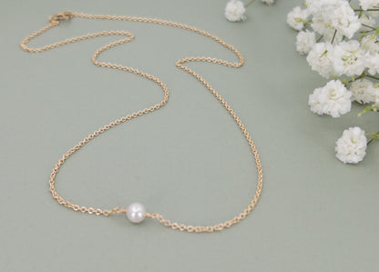 Lucia Add A Pearl Necklace shown with a single pearl on a gold chain