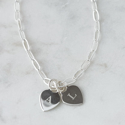 sterling silver heart charms engraved with a single letter