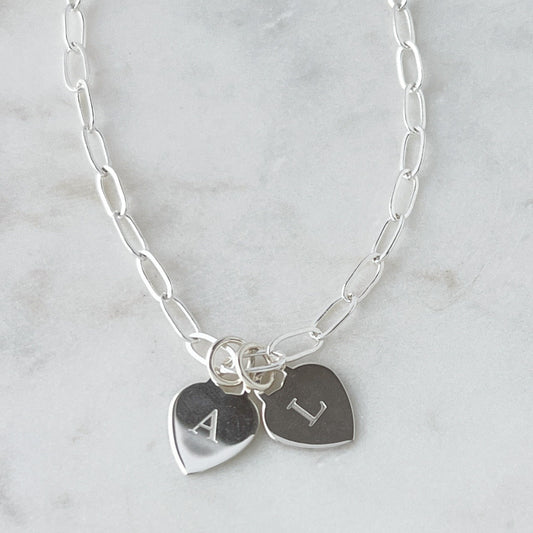 sterling silver heart charms engraved with a single letter