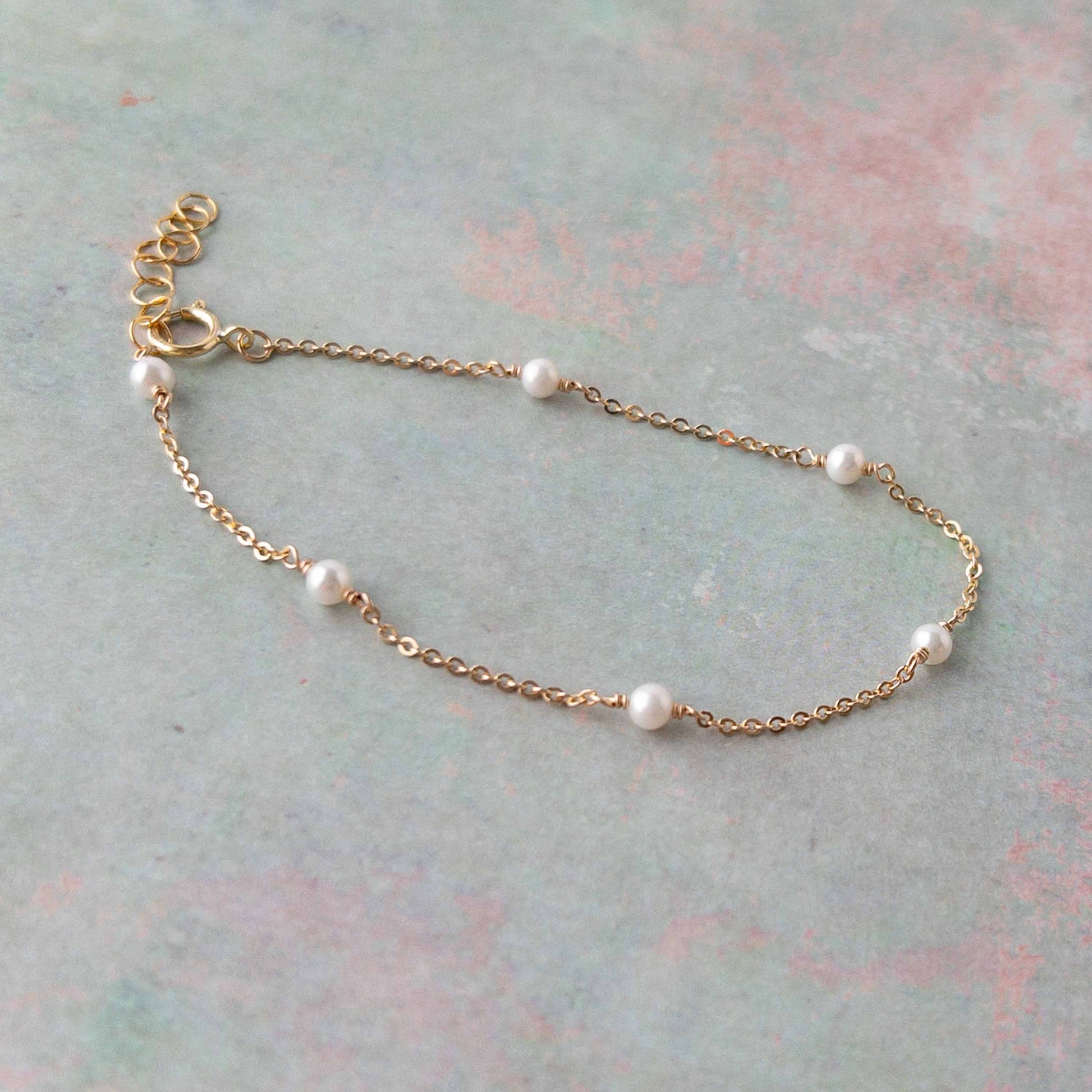Tiny pearls on a dainty gold filled chain bracelet for women