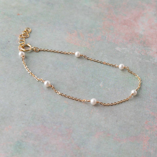 Tiny pearls on a dainty gold filled chain bracelet for women