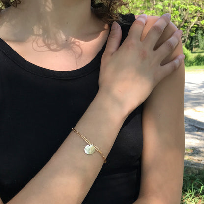 model wearing gold initial bracelet