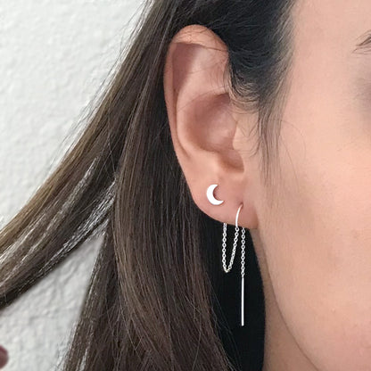close up of model wearing sterling silver moon for two hole earrings