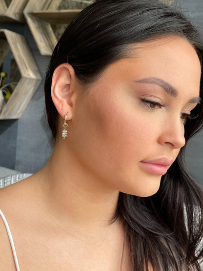 model wearing huggie hoop earrings with herkimer diamonds