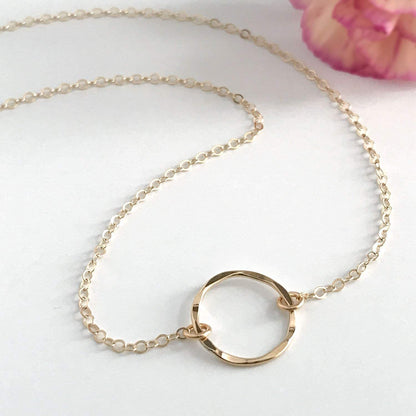 close up of hammered circle necklace
