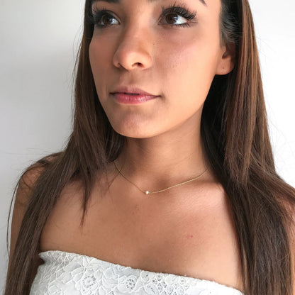 model wearing Lucia saltwater pearl necklace with 16 inch chain
