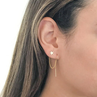 close up of model wearing star double piercing earring